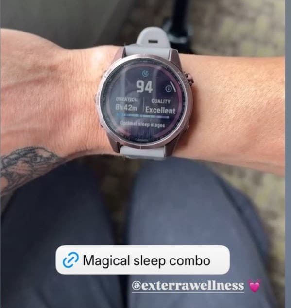 Fitness athlete's watch showing a sleep score of 94, quality Excellent, over the Exterra tag